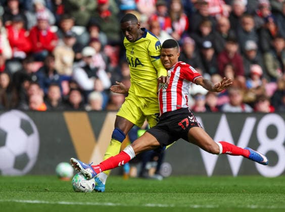 Sunderland, England, 12th April 2026. Randal Kolo Muani (L) Tottenham Hotspur in action with Reinildo Mandava of Sunderland during the Sunderland vs Tottenham Hotspur Premier League match at the Stadium Of Light, Sunderland. Picture credit should read: Nigel Roddis Sportimage EDITORIAL USE ONLY. No use with unauthorised audio, video, data, fixture lists, club league logos or live services. Online in-match use limited to 120 images, no video emulation. No use in betting, games or single club league player publications. SPI_057_NR_SUND_TOTT SPI-4681-0057