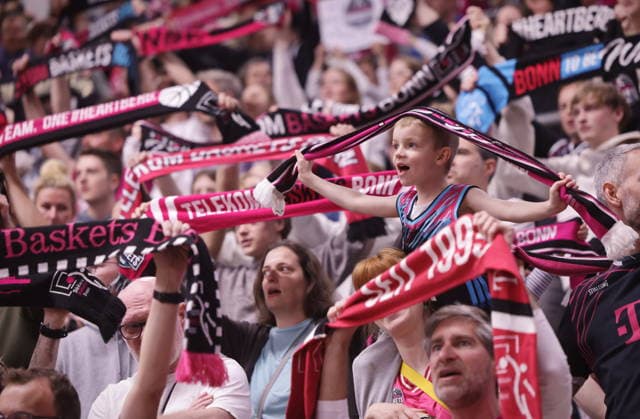 Fans with scarves Telekom Baskets Bonn vs Basketball Löwen Loewen Braunschweig 29 Speiltag Saison 2025 26