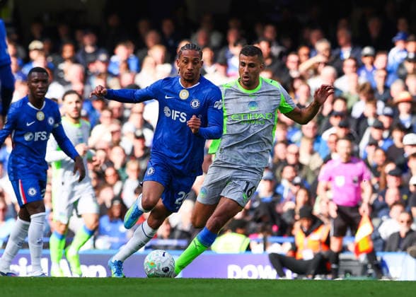 12th April 2026; Stamford Bridge, Chelsea, London, England: Premier League Football, Chelsea versus Manchester City; Joao Pedro of Chelsea under pressure from Rodri of Manchester City JPxFletcher