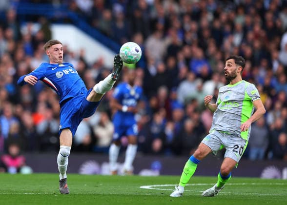 12th April 2026; Stamford Bridge, Chelsea, London, England: Premier League Football, Chelsea versus Manchester City; Cole Palmer of Chelsea under pressure from Bernardo Silva of Manchester City JPxFletcher
