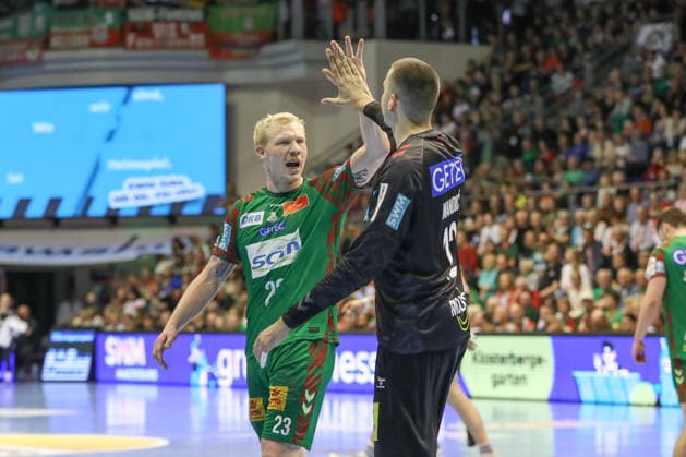 12 04 2026, xgox, Handball Daikin HBL SC Magdeburg HC Erlangen emspor, v l Magnus Saugstrup Magdeburg, 23 , Matej Mandic Magdeburg, 12 Cheers over held ball, defended, held, Torhueter Magdeburg