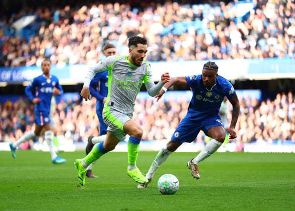 12th April 2026; Stamford Bridge, Chelsea, London, England: Premier League Football, Chelsea versus Manchester City; Rayan Cherki of Manchester City under pressure from Jorrel Hato of Chelsea JPxFletcher