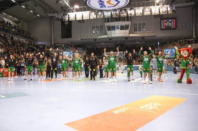 12 04 2026, xgox, Handball Daikin HBL SC Magdeburg HC Erlangen emspor, v l Magdeburg celebrating the victory, cheering after the end of the game Magdeburg