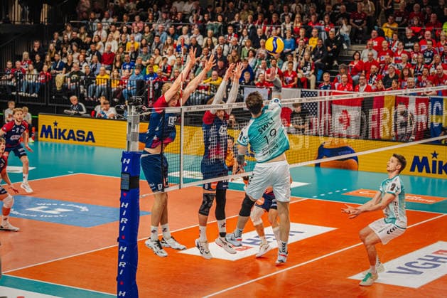 Volleyball Mens Bundesliga Playoffs Semifinals 2025 2026 SVG Lüneburg vs SWD powervolleys Düren 12 04 2026 Ryan Poole 19 SWD powervolleys Düren against the block of Axel Enlund 17 SVG Lüneburg and Jackson Howe 6 SVG Lüneburg