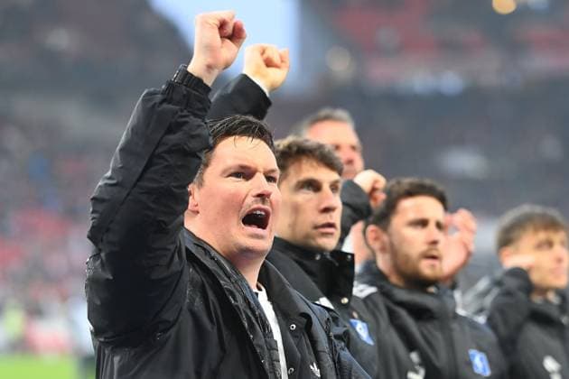 Merlin POLZIN Coach Hamburger SV after the end of the match, in front of the Hamburg fan block with a clenched fist, Soccer 1 Bundesliga Season 2025 2026, Matchday 29, Matchday 29 VfB Stuttgart Hamburger SV 4 0 on 12 04 2026 MHP ARENA