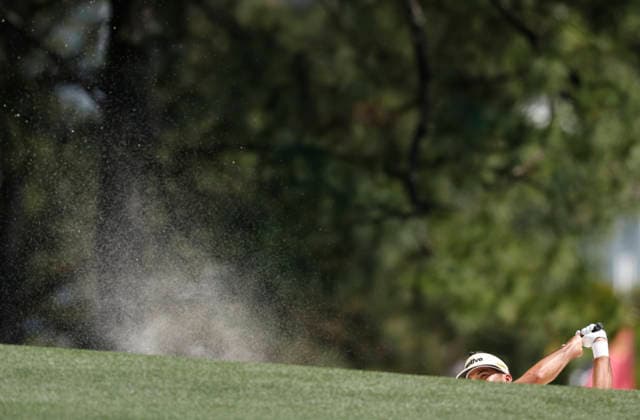 Jason Day of Australia hits out of a bunker on the 1st hole during the final round of the Masters Tournament at Augusta National Golf Club on Sunday, April 12, 2026, in Augusta, Georgia.  AUG20260412806 JOHNxANGELILLO