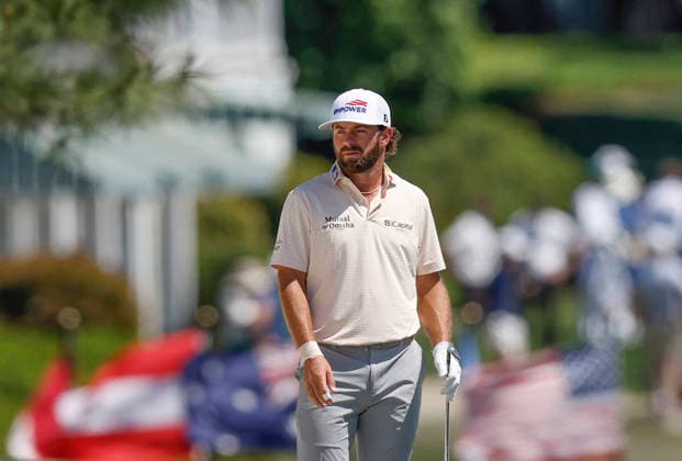 Cameron Young prepares to hit an approach shot on the 1st fairway during the final round of the Masters Tournament at Augusta National Golf Club on Sunday, April 12, 2026, in Augusta, Georgia.  AUG20260412817 JOHNxANGELILLO