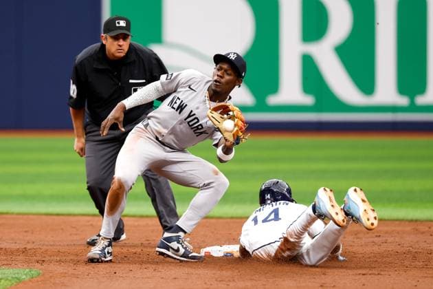 April 12, 2026, St. Petersburg, Florida, USA: Tampa Bay Rays left fielder Chandler Simpson (14) steals second base, while New York Yankees second baseman Jazz Chisholm Jr. (13) attempts to tag him out during the second inning at Tropicana Field on Sunday, April 12, 2026, in St. Petersburg. St. Petersburg USA - ZUMAs70_ 20260412_zan_s70_030 Copyright: xJeffereexWoox