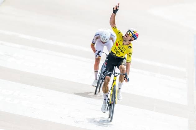 Belgian Wout van Aert of Team Visma-Lease a Bike celebrates as he crosses the finish line to win the men s Paris-Roubaix cycling race, Sunday 12 April 2026, around Roubaix, France. The 123rd edition of Paris-Roubaix cycling races will take on Sunday, with the women riding 143,1 km the men riding 258,3 km on Sunday. JASPERxJACOBS  x170603414x