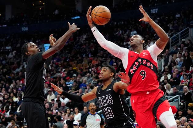 April 12, 2026, Toronto, On, CANADA: Toronto Raptors forward RJ Barrett (9) scoops the rebound from Brooklyn Nets forward Trevon Scott (13) as teammate Malachi Smith (18) looks on during first half NBA, Basketball Herren, USA basketball action in Toronto, Sunday, April 12, 2026. Canada News - April 12, 2026 - ZUMAc35_ 20260412_zaf_c35_056 Copyright: xFrankxGunnx