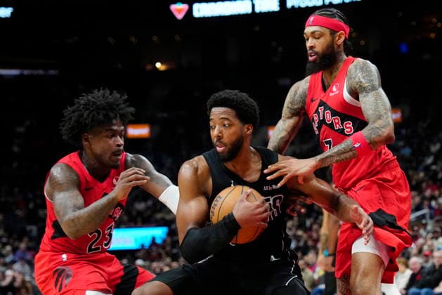 April 12, 2026, Toronto, On, CANADA: Toronto Raptors guard Jamal Shead (23) and treammate Brandon Ingram (3) team up to take the ball from Brooklyn Nets forward Chaney Johnson (31) during second half NBA, Basketball Herren, USA basketball action in Toronto, Sunday, April 12, 2026. Canada News - April 12, 2026 - ZUMAc35_ 20260412_zaf_c35_063 Copyright: xFrankxGunnx