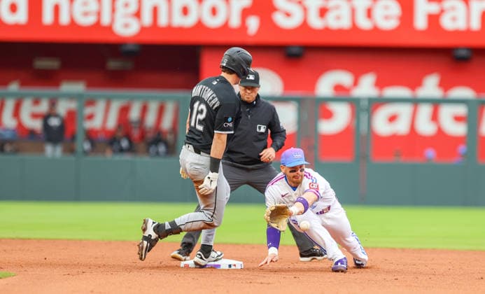 APR 12, 2026: Chicago White Sox shortstop Colson Montgomery (12) stands at second base while Kansas City Royals shortstop Bobby Witt Jr. (7) tries to field the ball at Kauffman Stadium in Kansas City, MO. CSM Kansas City United States - ZUMAc04_ 20260412_zma_c04_072 Copyright: xRomanxPunox