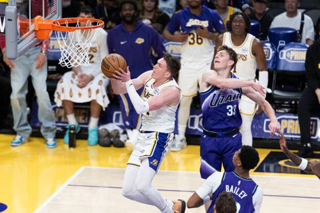 April 12, 2026, Los Angeles, California, United States: Los Angeles Lakers™ Dalton Knecht (4) goes past Utah Jazz™ Hayden Gray (33) to the basket during an NBA, Basketball Herren, USA basketball game at Crypto.com Arena on Sunday, April 12, 2026 in Los Angeles. Lakers 131:107 Jazz NBA 2026: Lakers 131:107 Jazz - 12 Apr 2026  - ZUMAs197 20260412_aaa_s197_318 Copyright: xRingoxChiux