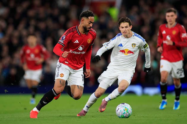 Manchester United, ManU v Leeds United, Premier League Matheus Cunha (10) of Manchester United runs past Brenden Aaronson (11) of Leeds United during the Premier League match between Manchester United and Leeds United at Old Trafford, Manchester, UK on 13 April 2026. Manchester Old Trafford Greater Manchester UK Editorial use only DataCo restrictions apply See www.football-dataco.com , Copyright: xConorxMolloyx PSI-24063-0049