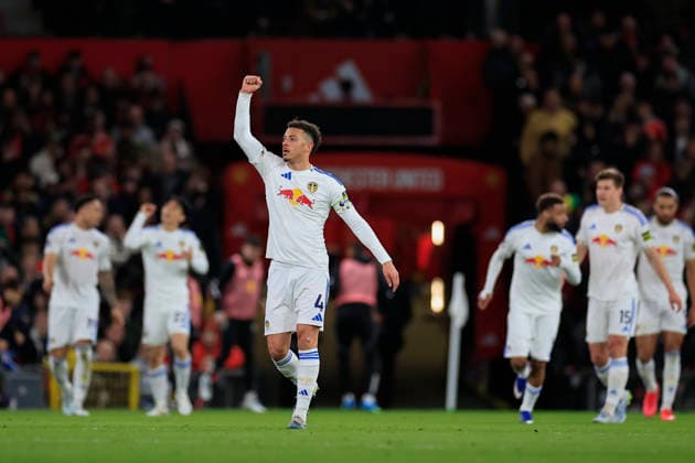 Manchester United, ManU v Leeds United, Premier League Ethan Ampadu (4) of Leeds United salutes the Leeds fans as they take a 0-2 lead during the Premier League match between Manchester United and Leeds United at Old Trafford, Manchester, UK on 13 April 2026. Manchester Old Trafford Greater Manchester UK Editorial use only DataCo restrictions apply See www.football-dataco.com , Copyright: xConorxMolloyx PSI-24063-0051