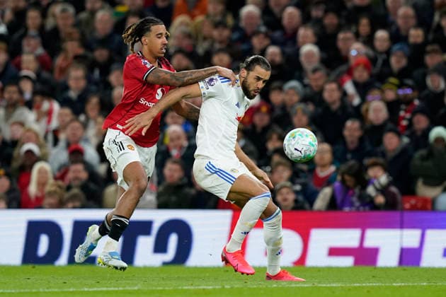 Manchester, England, 13th April 2026. Leny Yoro of Manchester United, ManU and Dominic Calvert-Lewin of Leeds United challenge for the ball during the Manchester United vs Leeds United Premier League match at Old Trafford, Manchester. Picture credit should read: Andrew Yates Sportimage EDITORIAL USE ONLY. No use with unauthorised audio, video, data, fixture lists, club league logos or live services. Online in-match use limited to 120 images, no video emulation. No use in betting, games or single club league player publications. SPI_050_AY_Man_Utd_Leeds SPI-4684-0050