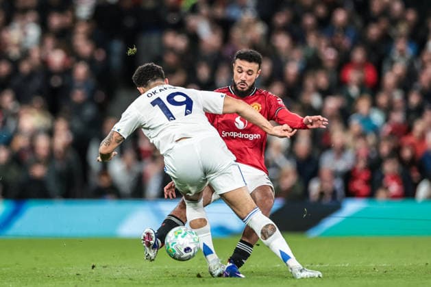 Premier League: Manchester United, ManU v Leeds United Noah Okafor of Leeds United and Noussair Mazraoui of Manchester United battle for the ball during the Premier League match Manchester United vs Leeds United at Old Trafford, Manchester, United Kingdom on 13 April 2026 (Photo by Mark Cosgrove News Images) Manchester Old Trafford Greater Manchester United Kingdom Copyright: xMarkxCosgrove NewsxImagesx
