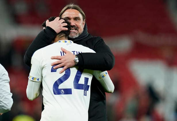 Manchester, England, 13th April 2026. Daniel Farke manager of Leeds United celebrate with James Justin of Leeds United after the Manchester United, ManU vs Leeds United Premier League match at Old Trafford, Manchester. Picture credit should read: Andrew Yates Sportimage EDITORIAL USE ONLY. No use with unauthorised audio, video, data, fixture lists, club league logos or live services. Online in-match use limited to 120 images, no video emulation. No use in betting, games or single club league player publications. SPI_085_AY_Man_Utd_Leeds SPI-4684-0085