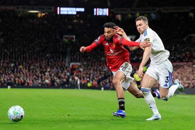 Manchester United, ManU v Leeds United, Premier League Gabriel Gudmundsson (3) of Leeds United is challenged by Noussair Mazraoui (3) of Manchester United during the Premier League match between Manchester United and Leeds United at Old Trafford, Manchester, UK on 13 April 2026. Manchester Old Trafford Greater Manchester UK Editorial use only DataCo restrictions apply See www.football-dataco.com , Copyright: xConorxMolloyx PSI-24063-0119