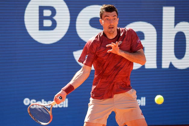 De Minaur v Ofner - Real Club de Tenis Barcelona 1899 Sebastian Ofner competes against Alex de Minaur during the round of 32 match on Day Two of the Barcelona Open Banc Sabadell 73rd Conde de Godo Trophy at Real Club de Tenis Barcelona 1899 in Barcelona, Spain, on April 14, 2026. Barcelona Barcelona Spain  Copyright: xUrbanandsportx originalFilename:urbanandsport-ofnervde260414_npatI.jpg