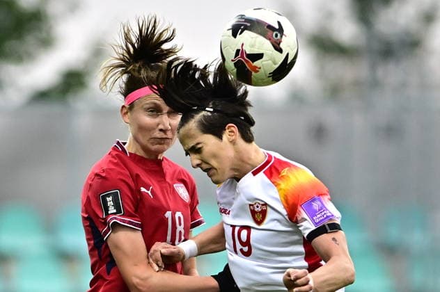 L-R Kamila Dubcova (Czechia) and Nada Stanovic (Montenegro) in action during the European qualifying part for 2027 Women s Football World Cup match, group B1: Czechia vs Montenegro, in Chomutov, Czech Republic, on April 14, 2026. (CTKxPhoto OndrejxHajek) CTKPhotoP2026041407569  CTKPhotoP2026041407569