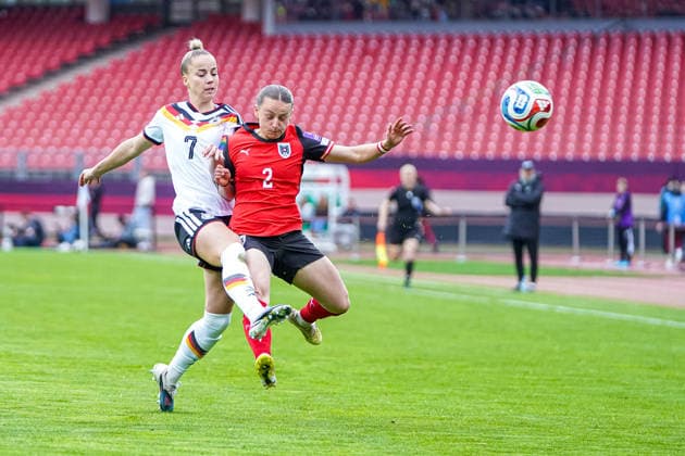 Giulia Gwinn 7 Germany and Chiara D Angelo 2 Austria in a duel for the ball during the international match between Germany Austria on 14 04 2026 in Nuremberg Nuremberg Max Morlock Stadium Bayern Germany
