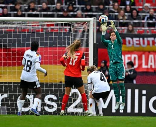 14 04 2026, World Cup Qualification Europe, Women 2026, Matchday 3, Germany Austria, at Max Morlock Stadium Nuremberg, Goalkeeper Ann Katrin Berger Germany plucks the ball down from l Nicole Anyomi Germany , Sarah Puntigam Austria , Rebecca Knaak Germany and goalkeeper Ann Katrin Berger Germany