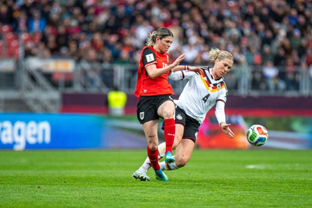 Eileen Campbell 10 Austria and Rebecca Knaak 4 Germany in a duel for the ball during the international match between Germany Austria on 14 04 2026 in Nuremberg Nuremberg Max Morlock Stadium Bayern Germany