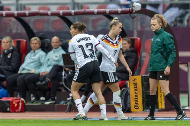 GER, nuremburg, football, womens football, womens world cup qualifiers, matchday 3, Germany vs. Austria in picture f.l.: substitution Carlotta Wamser (Germany 13), Giulia Gwinn (Germany 07), is leaving the pitch after getting injured during a tackle 14.04.2026, Max-Morlock Stadium Nuremberg DFB REGULATIONS PROHIBIT ANY USE OF PHOTOGRAPHS AS IMAGE SEQUENCES AND OR QUASI-VIDEO, Nuremberg Max-Morlock Stadium Bavaria Germany Copyright: xPaulxFritzx