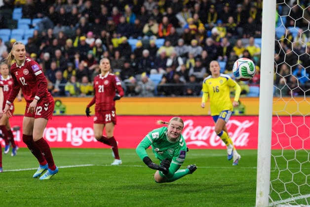GOTHENBURG, SWEDEN 20260414 Denmarks goalkeeper Freja R Thisgaard and Stine Sandbech 12 watch the ball go out of bounds during Tuesdays World Cup qualifying soccer match between Sweden and Denmark at Gamla Ullevi in Gothenburg GOTHENBURG SWEDEN x9200x  Copyright: xAdamxIhse TTx VM-KVAL SVERIGE-DANMARK