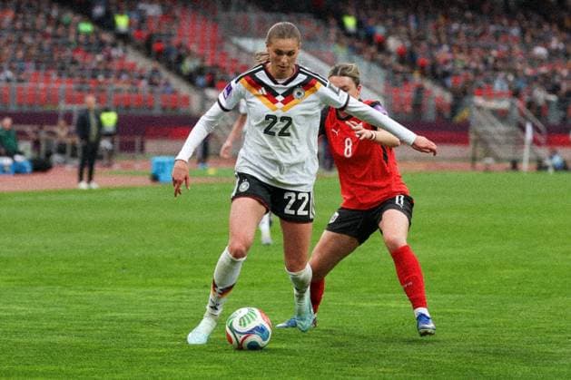 Jule Brand 22 Germany in action against Barbara Dunst 8 Austria , Germany vs. Austria, DFB, Soccer, Women, Womens World Cup Qualification, Group stage, Group D, Matchday 3 of 6, Season 2025 26, 14 04 2026 Nuremberg Bavaria Germany Copyright: xkolbert-press MartinxAgüerax