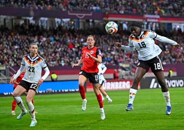 14 04 2026, World Cup Qualification Europe, Women 2026, Matchday 3, Germany Austria, at Max Morlock Stadium Nuremberg, f l Jule Brand Germany , Verena Hanshaw Austria and Nicole Anyomi Germany