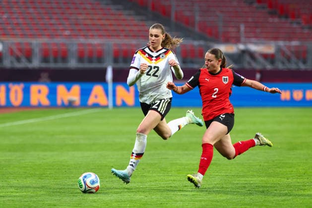 Jule Brand 22, Germany and Chiara D Angelo 2, Austria during the match between Germany v Austria, Soccer, Women, Womens World Cup Qualification, 2025 2026, Matchday 3 on 14 04 2026 in Nuremberg, Max Morlock Stadium Bayern Germany