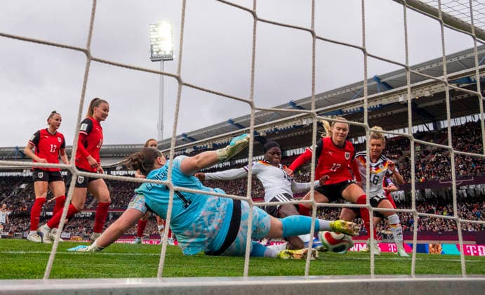 14 04 2026, World Cup Qualification Europe, Women 2026, Matchday 3, Germany Austria, at Max Morlock Stadium Nuremberg, Nicole Anyomi center, Germany scores 1 0 against goalkeeper Mariella El Sherif left, Austria