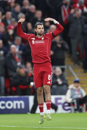 Liverpool, England, 14th April 2026. Dominik Szoboszlai of Liverpool encourages the fans during the Liverpool vs Paris Saint Germain UEFA Champions League quarter final 2nd leg match at Anfield, Liverpool. Picture credit should read: Jessica Hornby Sportimage EDITORIAL USE ONLY. No use with unauthorised audio, video, data, fixture lists, club league logos or live services. Online in-match use limited to 120 images, no video emulation. No use in betting, games or single club league player publications. SPI_049_JH_Liverpool_PSG SPI-4687-0048