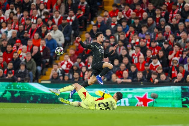Football - UEFA Champions League - Quarter-Final - 2nd Leg - Liverpool FC v Paris Saint-Germain FC LIVERPOOL, ENGLAND - Tuesday, April 14, 2026: Liverpool s goalkeeper Giorgi Mamardashvili makes a sliding challenge on Paris Saint-Germain Warren ZaÃ¯re-Emery (R) during the UEFA Champions League Quarter-Final 2nd Leg match between Liverpool FC and Paris Saint-Germain FC at Anfield. (Photo by David Rawcliffe Propaganda) LIVERPOOL Anfield MERSEYSIDE ENGLAND  Copyright: xDavidxRawcliffex P2026-04-14-Liverpool_PSG-46