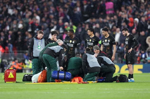 Liverpool, England, 14th April 2026. Paris St Germain players gather around an injured Hugo Ekitike of Liverpool show concern during the Liverpool vs Paris Saint Germain UEFA Champions League quarter final 2nd leg match at Anfield, Liverpool. Picture credit should read: Jessica Hornby Sportimage EDITORIAL USE ONLY. No use with unauthorised audio, video, data, fixture lists, club league logos or live services. Online in-match use limited to 120 images, no video emulation. No use in betting, games or single club league player publications. SPI_066_JH_Liverpool_PSG SPI-4687-0066