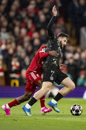 Liverpool v Paris Saint-Germain - UEFA Champions League 2025 26 LIVERPOOL, ENGLAND- APRIL 14: Jeremie Frimpong of Liverpool and Khvicha Kvaratskhelia of Paris Saint-Germain fight for possession during a UEFA Champions League 2025 26 match between Liverpool and Paris Saint-Germain in Liverpool on April 14, 2026 (Photo by Will Palmer Sports Press Photo) LiverpoolUnited Kingdom  Copyright: xWillxPalmer SportsxPressxPhotox