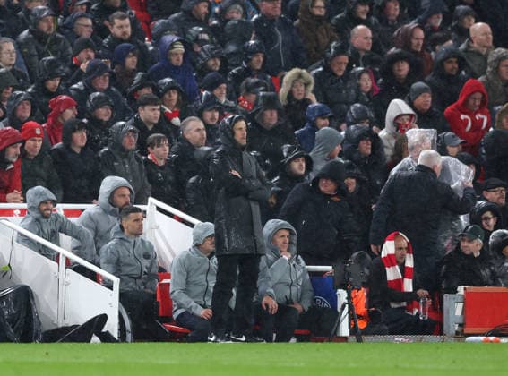 Liverpool, England, 14th April 2026. Luis Enrique coach of Paris St Germain looks on in the pouring rain during the Liverpool vs Paris Saint Germain UEFA Champions League quarter final 2nd leg match at Anfield, Liverpool. Picture credit should read: Jessica Hornby Sportimage EDITORIAL USE ONLY. No use with unauthorised audio, video, data, fixture lists, club league logos or live services. Online in-match use limited to 120 images, no video emulation. No use in betting, games or single club league player publications. SPI_083_JH_Liverpool_PSG SPI-4687-0083