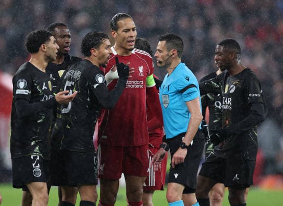 Liverpool, England, 14th April 2026. Marquinhos of Paris Saint-Germain challenges referee Maurizio Mariani after he awarded Liverpool a penalty during the Liverpool vs Paris Saint Germain UEFA Champions League quarter final 2nd leg match at Anfield, Liverpool. Picture credit should read: Jessica Hornby Sportimage EDITORIAL USE ONLY. No use with unauthorised audio, video, data, fixture lists, club league logos or live services. Online in-match use limited to 120 images, no video emulation. No use in betting, games or single club league player publications. SPI_091_JH_Liverpool_PSG SPI-4687-0091
