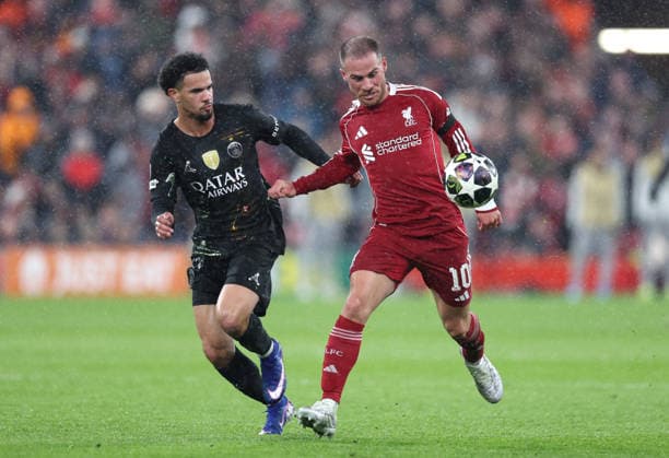Liverpool, England, 14th April 2026. Warren Zaire-Emery of Paris St Germain tussles with Alexis Mac Allister of Liverpool during the Liverpool vs Paris Saint Germain UEFA Champions League quarter final 2nd leg match at Anfield, Liverpool. Picture credit should read: Jessica Hornby Sportimage EDITORIAL USE ONLY. No use with unauthorised audio, video, data, fixture lists, club league logos or live services. Online in-match use limited to 120 images, no video emulation. No use in betting, games or single club league player publications. SPI_094_JH_Liverpool_PSG SPI-4687-0094