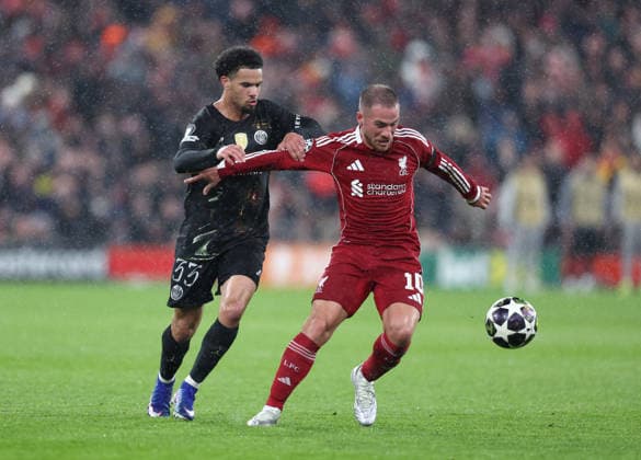 Liverpool, England, 14th April 2026. Warren Zaire-Emery of Paris St Germain tussles with Alexis Mac Allister of Liverpool during the Liverpool vs Paris Saint Germain UEFA Champions League quarter final 2nd leg match at Anfield, Liverpool. Picture credit should read: Jessica Hornby Sportimage EDITORIAL USE ONLY. No use with unauthorised audio, video, data, fixture lists, club league logos or live services. Online in-match use limited to 120 images, no video emulation. No use in betting, games or single club league player publications. SPI_095_JH_Liverpool_PSG SPI-4687-0095
