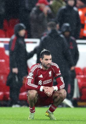 Liverpool, England, 14th April 2026. Dominik Szoboszlai of Liverpool dejected during the Liverpool vs Paris Saint Germain UEFA Champions League quarter final 2nd leg match at Anfield, Liverpool. Picture credit should read: Jessica Hornby Sportimage EDITORIAL USE ONLY. No use with unauthorised audio, video, data, fixture lists, club league logos or live services. Online in-match use limited to 120 images, no video emulation. No use in betting, games or single club league player publications. SPI_111_JH_Liverpool_PSG SPI-4687-0111