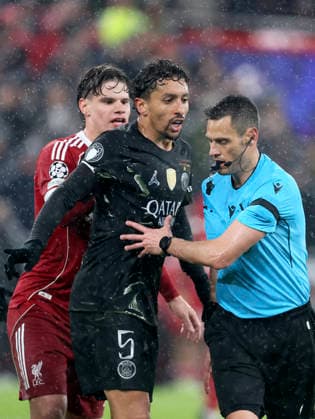 Liverpool FC v Paris Saint-Germain FC - UEFA Champions League 2025 26 Quarter-Final Second Leg Marquinhos of Paris Saint-Germain and Referee Maurizio Mariani during the UEFA Champions League 2025 26 Quarter-Final Second Leg match between Liverpool FC and Paris Saint-Germain FC at Anfield on April 14, 2026 in Liverpool, England. WARNING! This Photograph May Only Be Used For Newspaper And Or Magazine Editorial Purposes. May Not Be Used For Publications Involving 1 player, 1 Club Or 1 Competition Without Written Authorisation From Football DataCo Ltd. For Any Queries, Please Contact Football DataCo Ltd on +44 (0) 207 864 9121 Liverpool Anfield England United Kingdom Copyright: xAllstarxPicturexLibraryxLtdx