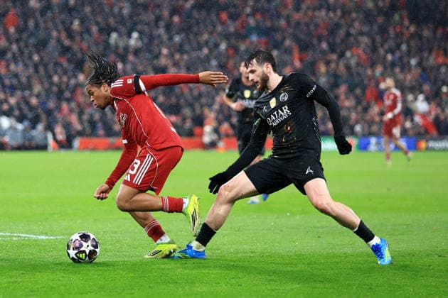 Liverpool, England, 14th April 2026. Rio Ngumoha of Liverpool is challenged by Khvicha Kvaratskhelia of Paris Saint-Germain during the Liverpool vs Paris Saint Germain UEFA Champions League quarter final 2nd leg match at Anfield, Liverpool. Picture credit should read: Jessica Hornby Sportimage EDITORIAL USE ONLY. No use with unauthorised audio, video, data, fixture lists, club league logos or live services. Online in-match use limited to 120 images, no video emulation. No use in betting, games or single club league player publications. SPI_121_JH_LIVERPOOL_PSG SPI-4687-0121