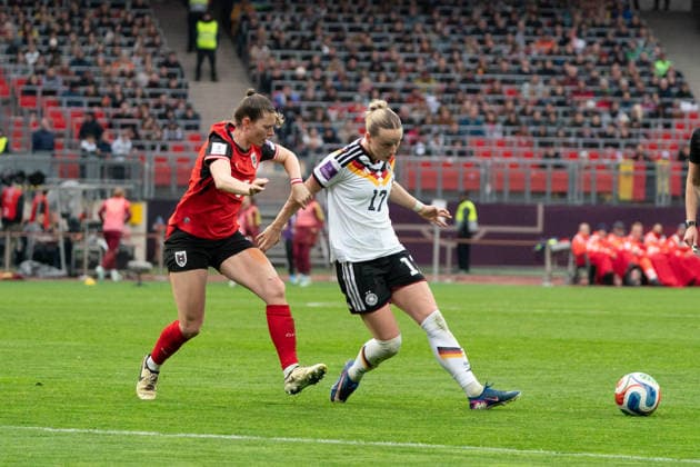NUREMBERG, GERMANY - APRIL 14: Claudia Wenger (5 Austria) and Franziska Kett (17 Germany) during the FIFA Women s World Cup Qualification match between Germany and Austria at Max-Morlock-Stadion on April 14, 2026 in Nuremberg, Germany. (Photo by Qianru Zhang Press Photo) Copyright: xQianruxZhang SPPx Sportspressphoto_SPR129727