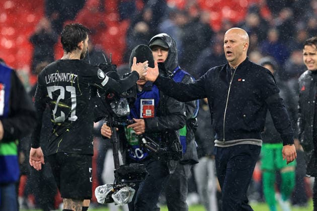 RECORD DATE NOT STATED 14th April 2026; Anfield, Liverpool, Merseyside, England; UEFA Champions League Football, Liverpool versus Paris Saint Germain; Liverpool manager Arne Slot shakes hands with Lucas Hernandez of Paris Saint Germain at full time DavidxBlunsden