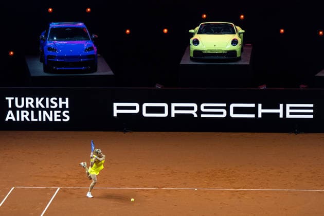 Laura Siegemund Germany in the picture, behind her Porsche branding and Porsche 911, Laura Siegemund Germany vs Iga Swiatek Poland , GER, Porsche Tennis Grand Prix Stuttgart, WTA 500, 15 04 2026 GER, Porsche Tennis Grand Prix Stuttgart, WTA 500, 15 04 2026 Stuttgart Copyright: xEibner-Pressefoto Memmlerx EP_MMR