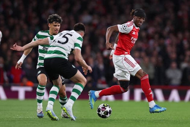 London, England, 15th April 2026. Noni Madueke of Arsenal is challenged by Maximiliano Araujo (L) and Goncalo Inacio of Sporting Lisbon during the Arsenal vs Sporting Lisbon UEFA Champions League quarter final 2nd leg match at the Emirates Stadium, London. Picture credit should read: David Klein Sportimage EDITORIAL USE ONLY. No use with unauthorised audio, video, data, fixture lists, club league logos or live services. Online in-match use limited to 120 images, no video emulation. No use in betting, games or single club league player publications. SPI_028_DK_Arsenal_Sporting_Lisbon SPI-4686-0028
