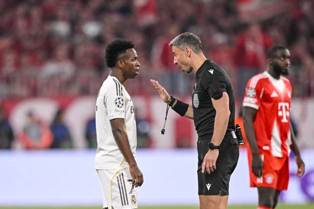 Vinicius Junior Real Madrid and referee Slavko Vincic gestures during the UEFA Champions League 2025 26 Quarter Final Second Leg match between FC Bayern Munich and Real Madrid CF at Football Arena Munich on April 15, 2026 in Munich, Germany Photo by Harry Langer DeFodi Images